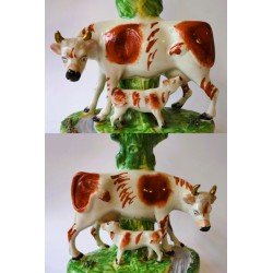 Staffordshire Pottery Pair cow and calf spill vases